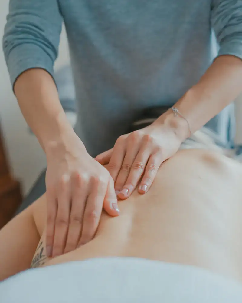 Hands giving a slow back massage